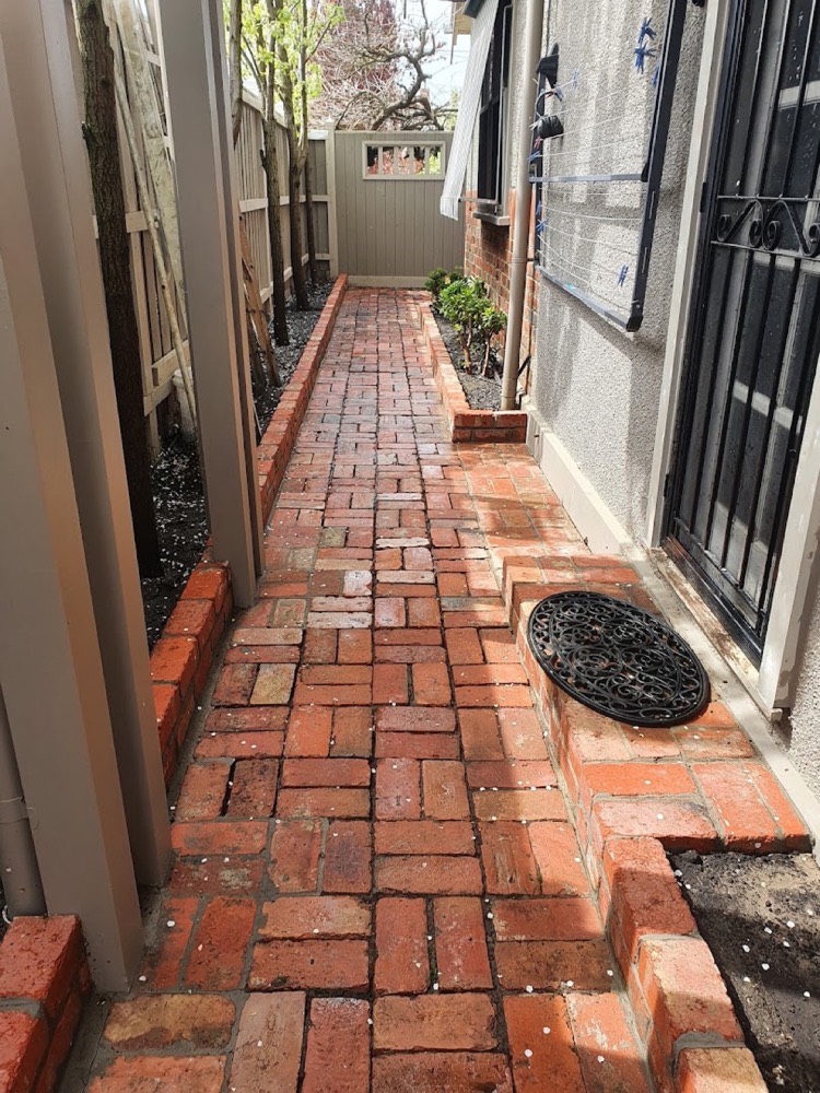 A narrow brick side path in Ballarat washed clean end to end